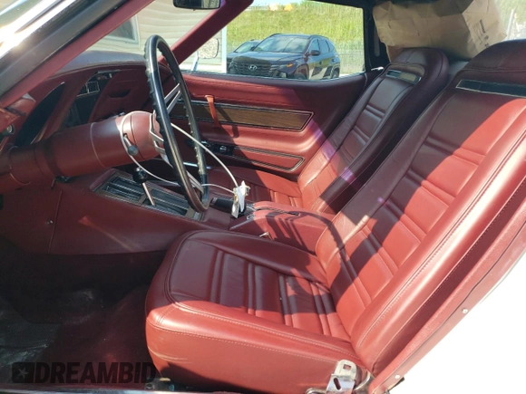1974 Chevrolet Corvette with VIN 1Z67J4S405054, listed as a Copart auction lot 66356575 with 7,810 mi miles and Salvage title. Bid and sale history available at DreamBid. Image 7.