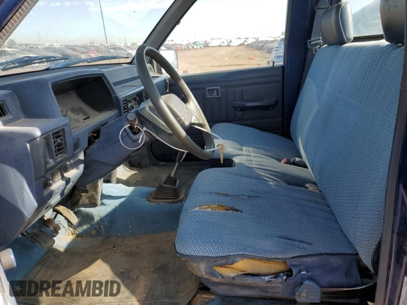 1994 Mitsubishi Mighty Max z VIN JA7LS21G4RP009588, wystawiony jako Copart lot #60519834 z przebiegiem 123 918 mil mil oraz Szkoda całkowita • Salvage title. Historia ofert i sprzedaży dostępna na DreamBid. Obrazek 7.
