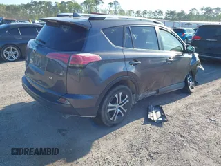 2016 Toyota RAV4 LE with VIN JTMZFREV7GJ065267, listed as a IAAI auction lot 42011267 with 180,127 mi miles. Bid and sale history available at carsss.com. Image 4.