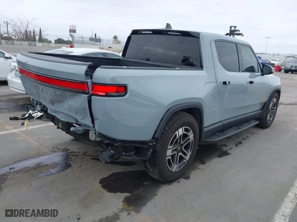 2023 Rivian R1T Launch Edition with VIN 7FCTGAAL3PN017339, listed as a IAAI auction lot 42041423 with 15,098 mi miles. Bid and sale history available at carsss.com. Image 4.