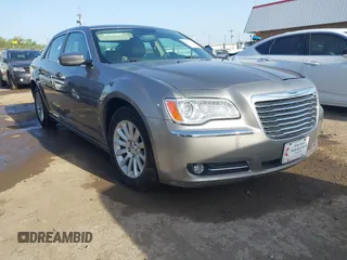 2014 Chrysler 300 with VIN 2C3CCAAG4EH159911, listed as a IAAI auction lot 41963042 with 105,972 mi miles and . Bid and sale history available at DreamBid. Image 1.