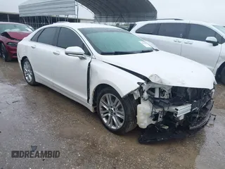 2014 Lincoln MKZ z VIN 3LN6L2G98ER803899, wystawiony jako IAAI lot #41890385 z przebiegiem 145 387 mil mil oraz . Historia ofert i sprzedaży dostępna na DreamBid. Obrazek 1.