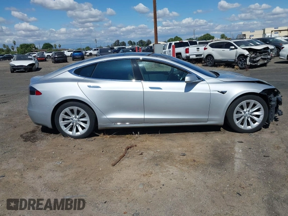 2016 Tesla Model S 90D with VIN 5YJSA1E22GF174637, listed as a IAAI auction lot 42234083 with 142,915 mi miles and . Bid and sale history available at DreamBid. Image 14.