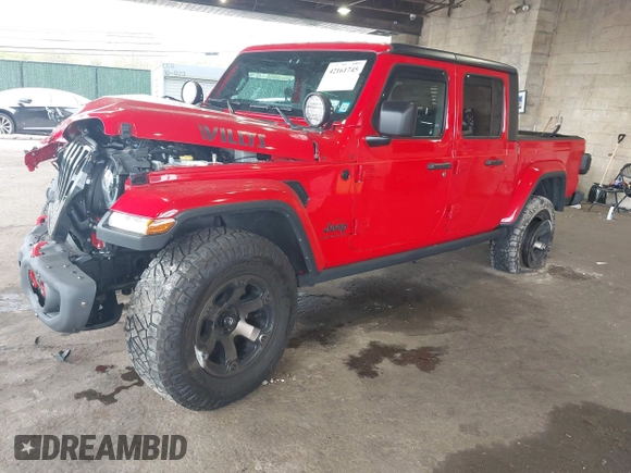2021 Jeep Gladiator Willys with VIN 1C6HJTAG7ML602130, listed as a IAAI auction lot 42161745 with 49,576 mi miles and . Bid and sale history available at DreamBid. Image 2.