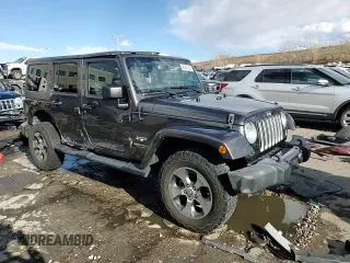 2017 Jeep Wrangler Unlimited Sahara with VIN 1C4HJWEG4HL615069, listed as a Copart auction lot 46480225 with 104,723 mi miles and Salvage title. Bid and sale history available at DreamBid. Image 14.