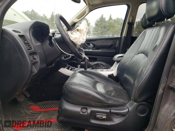 2005 Mercury Mariner Luxury z VIN 4M2YU57185DJ27043, wystawiony jako Copart lot #52980555 z przebiegiem 152 406 mil mil oraz Szkoda całkowita • Salvage title. Historia ofert i sprzedaży dostępna na DreamBid. Obrazek 7.