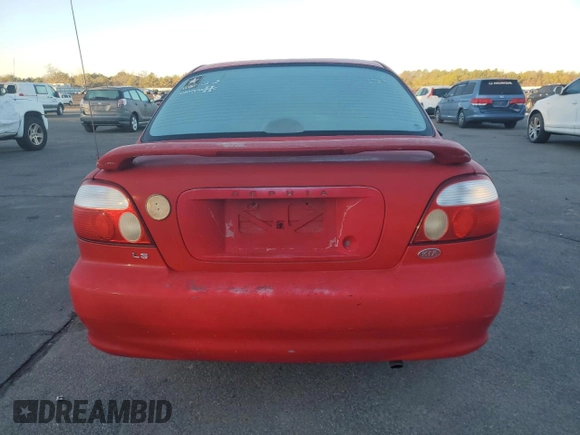 2001 Kia Sephia z VIN KNAFB121715066725, wystawiony jako Copart lot #86552964 z przebiegiem 76 915 mil mil oraz Tytuł czysty. Historia ofert i sprzedaży dostępna na DreamBid. Obrazek 6.