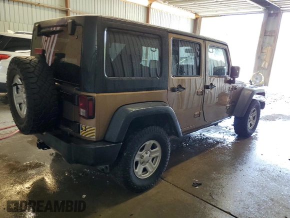 2015 Jeep Wrangler Unlimited Freedom with VIN 1C4BJWDG5FL713046, listed as a Copart auction lot 58563455 with 144,179 mi miles and Salvage title. Bid and sale history available at DreamBid. Image 3.