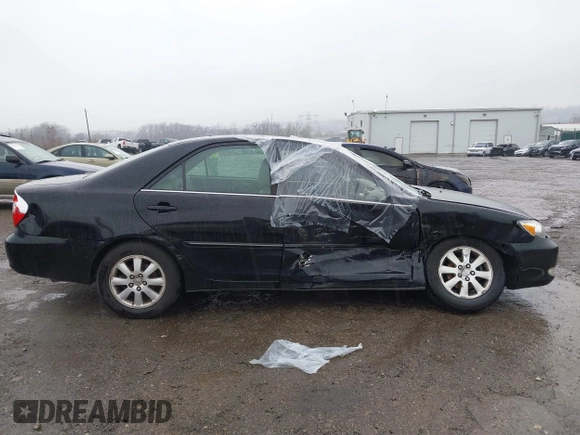 2003 Toyota Camry LE with VIN 4T1BE30K13U144114, listed as a IAAI auction lot 41829879 with 60,385 mi miles and . Bid and sale history available at DreamBid. Image 13.