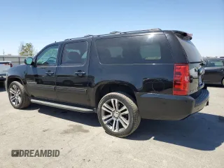 2014 Chevrolet Suburban LS with VIN 1GNSCHE03ER132039, listed as a Copart auction lot 68390234 with 129,744 mi miles and Salvage Title. Bid and sale history available at carsss.com. Image 2.
