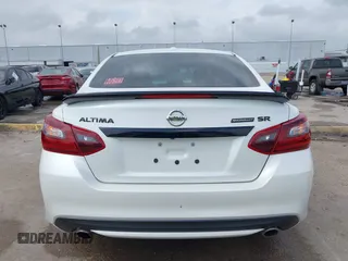 2018 Nissan Altima SR with VIN 1N4AL3AP3JC290863, listed as a IAAI auction lot 41933628 with 121,771 mi miles and . Bid and sale history available at carsss.com. Image 16.