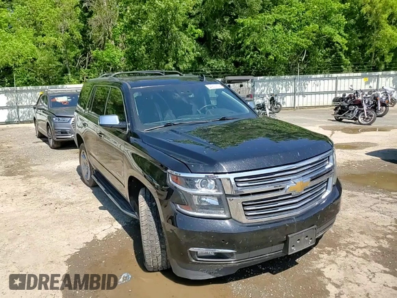 2018 Chevrolet Tahoe Premier with VIN 1GNSKCKC1JR133625, listed as a Copart auction lot 54900974 with 130,921 mi miles and Salvage title. Bid and sale history available at DreamBid. Image 12.