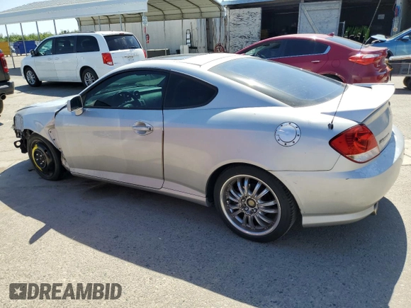 2006 Hyundai Tiburon GT z VIN KMHHN65F26U225506, wystawiony jako Copart lot #56997285 z przebiegiem 170 175 mil mil oraz Szkoda całkowita • Salvage title. Historia ofert i sprzedaży dostępna na DreamBid. Obrazek 2.