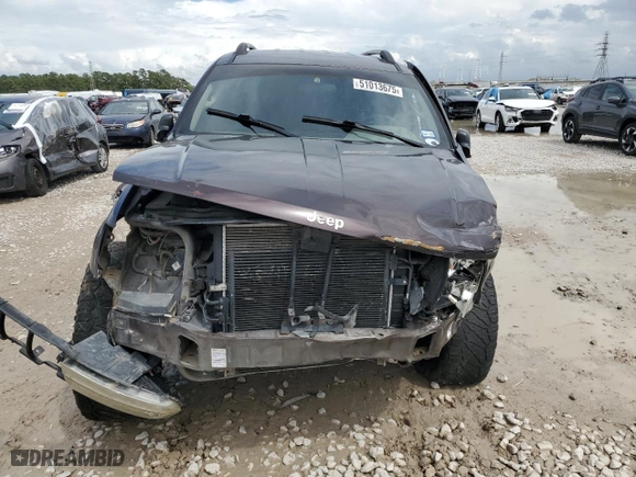 2004 Jeep Grand Cherokee Laredo with VIN 1J4GX48S44C150571, listed as a Copart auction lot 51013675 with 260,986 mi miles and Salvage Title. Bid and sale history available at carsss.com. Image 5.