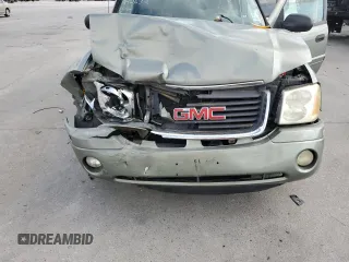 2003 GMC Envoy SLE with VIN 1GKES16P636242632, listed as a Copart auction lot 75960974 with Not Provided miles and Salvage Title. Bid and sale history available at DreamBid. Image 12.
