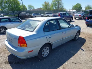 2005 Hyundai Accent GLS with VIN KMHCG45C75U658672, listed as a IAAI auction lot 42107140 with 34,351 mi miles. Bid and sale history available at carsss.com. Image 4.