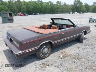 1982 Chrysler LeBaron z VIN 1C3BC55D2CG145033, wystawiony jako IAAI lot #42145500 z przebiegiem 20 643 mil mil oraz . Historia ofert i sprzedaży dostępna na DreamBid. Obrazek 4.