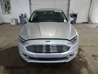 2017 Ford Fusion Hybrid Titanium with VIN 3FA6P0RU4HR223512, listed as a Copart auction lot 58739435 with 174,604 mi miles and Clean title. Bid and sale history available at DreamBid. Image 5.