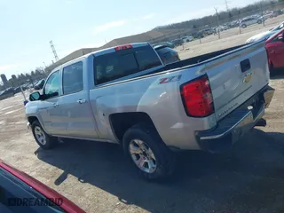 2015 Chevrolet Silverado 1500 LT with VIN 3GCUKREC0FG316716, listed as a IAAI auction lot 41908921 with 242,093 mi miles. Bid and sale history available at carsss.com. Image 3.