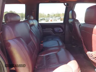 1999 Chevrolet Suburban with VIN 3GNEC16R0XG137834, listed as a IAAI auction lot 41853492 with 296,147 mi miles. Bid and sale history available at carsss.com. Image 8.