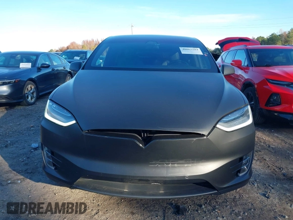 2020 Tesla Model X Long Range with VIN 5YJXCDE28LF298553, listed as a IAAI auction lot 40863184 with 54,031 mi miles and . Bid and sale history available at DreamBid. Image 12.