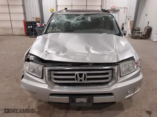 2014 Honda Ridgeline RTL with VIN 5FPYK1F57EB012362, listed as a IAAI auction lot 41078509 with 149,590 mi miles. Bid and sale history available at carsss.com. Image 6.