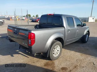 2021 Nissan Frontier SV with VIN 1N6ED0EB2MN702654, listed as a IAAI auction lot 42227414 with 142,309 mi miles and . Bid and sale history available at DreamBid. Image 4.
