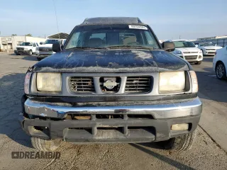 2000 Nissan Frontier XE z VIN 1N6ED27Y2YC369211, wystawiony jako Copart lot #80594884 z przebiegiem 225 194 mil mil oraz Czysty tytuł • Clean title. Historia ofert i sprzedaży dostępna na DreamBid. Obrazek 5.
