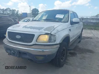 2002 Ford F-150 XLT with VIN 1FTRW08L02KA10457, listed as a IAAI auction lot 41704625 with 151,072 mi miles. Bid and sale history available at carsss.com. Image 2.