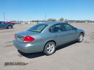 2005 Ford Taurus SE with VIN 1FAFP53U05A273576, listed as a IAAI auction lot 42140404 with 58,735 mi miles. Bid and sale history available at carsss.com. Image 4.