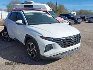 2022 Hyundai Tucson SEL z VIN 5NMJF3AE5NH001179, wystawiony jako IAAI lot #37328405 z przebiegiem 22 711 mil mil oraz . Historia ofert i sprzedaży dostępna na DreamBid. Obrazek 1.