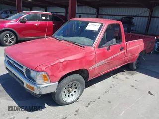 1992 Toyota Pickup DLX z VIN JT4RN82P8N5056666, wystawiony jako IAAI lot #42320829 z przebiegiem 147 032 mil mil oraz . Historia ofert i sprzedaży dostępna na DreamBid. Obrazek 2.