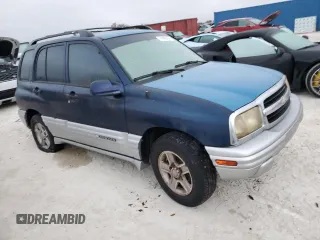 2002 Chevrolet Tracker LT with VIN 2CNBE634126928532, listed as a Copart auction lot 76990704 with Not provided miles and Salvage title. Bid and sale history available at DreamBid. Image 4.