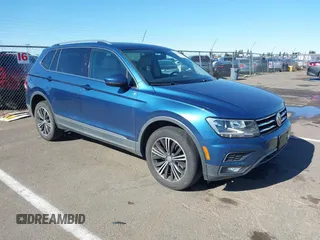 2018 Volkswagen Tiguan SEL z VIN 3VV3B7AX7JM008561, wystawiony jako IAAI lot #41490085 z przebiegiem 74 390 mil mil oraz . Historia ofert i sprzedaży dostępna na DreamBid. Obrazek 1.