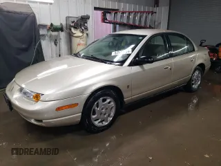 2000 Saturn SL z VIN 1G8ZK5278YZ269342, wystawiony jako Copart lot #82573694 z przebiegiem 53 641 mil mil oraz Szkoda całkowita • Salvage title. Historia ofert i sprzedaży dostępna na DreamBid. Obrazek 1.