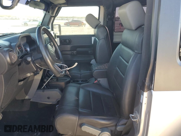 2009 Jeep Wrangler Rubicon with VIN 1J8GA64159L700909, listed as a Copart auction lot 86308954 with 138,065 mi miles and Salvage title. Bid and sale history available at DreamBid. Image 7.