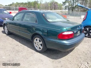 2001 Mazda 626 LX with VIN 1YVGF22D915241384, listed as a IAAI auction lot 41927705 with 231,801 mi miles. Bid and sale history available at carsss.com. Image 3.