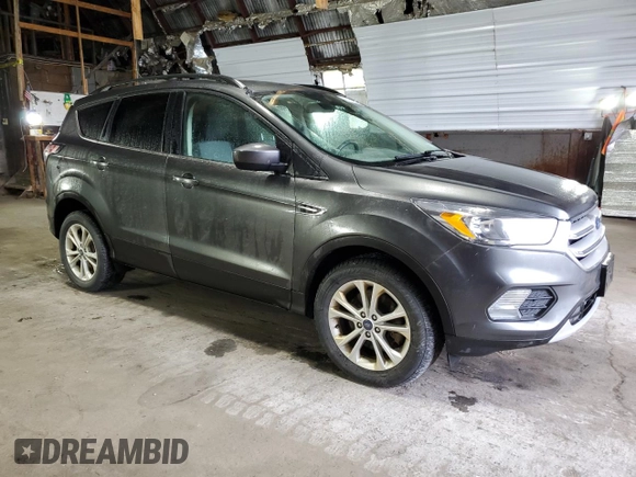 2018 Ford Escape SE z VIN 1FMCU9GD7JUA68705, wystawiony jako Copart lot #58275145 z przebiegiem 200 695 mil mil oraz Tytuł czysty. Historia ofert i sprzedaży dostępna na DreamBid. Obrazek 4.