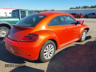 2019 Volkswagen Beetle S with VIN 3VWFD7AT7KM719940, listed as a IAAI auction lot 41190839 with 77,627 mi miles. Bid and sale history available at carsss.com. Image 4.