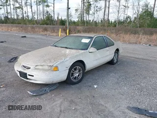 1996 Ford Thunderbird LX with VIN 1FALP62W4TH154400, listed as a IAAI auction lot 41394723 with 65,860 mi miles and . Bid and sale history available at DreamBid. Image 2.
