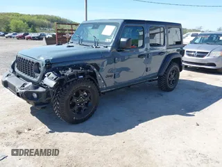 2024 Jeep Wrangler Sport S with VIN 1C4PJXDN2RW351741, listed as a IAAI auction lot 42122651 with 4,241 mi miles and . Bid and sale history available at DreamBid. Image 2.