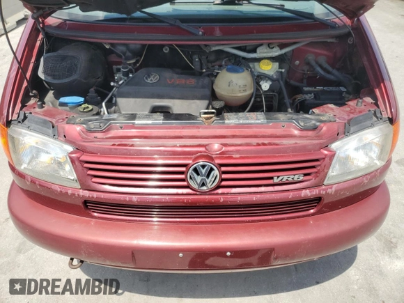 1999 Volkswagen EuroVan с VIN WV2MH2703XH045037, выставлен на аукционе Copart как лот 57109265 с пробегом 265 855 миль миль и Списание • Salvage title. История ставок и продаж доступна на DreamBid. Изображение 12.