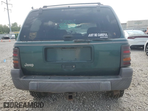 1997 Jeep Grand Cherokee Laredo with VIN 1J4GZ58SXVC595012, listed as a Copart auction lot 59746655 with Not provided miles and Salvage title. Bid and sale history available at DreamBid. Image 6.