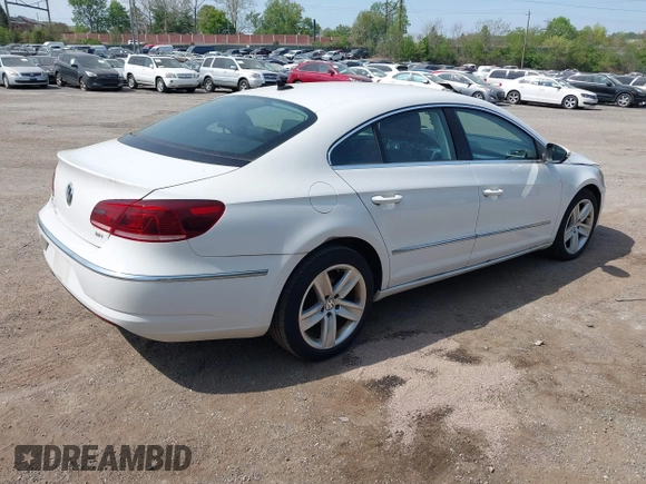 2013 Volkswagen CC Sport with VIN WVWBP7AN0DE523261, listed as a IAAI auction lot 42106039 with 136,105 mi miles. Bid and sale history available at carsss.com. Image 4.