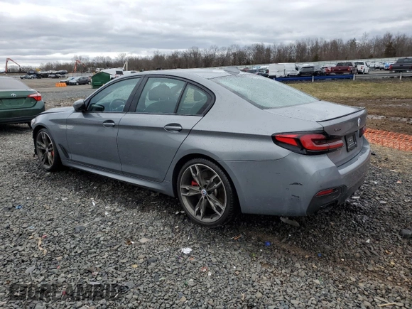 2023 BMW 5 Series M550i xDrive with VIN WBA13BK06PCN02733, listed as a Copart auction lot 48767235 with 27,725 mi miles and Salvage title. Bid and sale history available at DreamBid. Image 2.