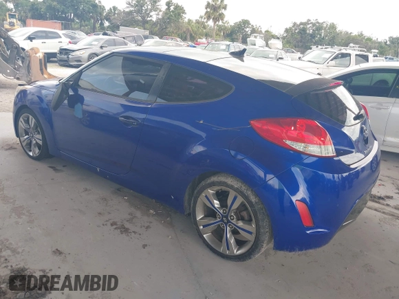 2012 Hyundai Veloster w/Gray Int z VIN KMHTC6AD0CU034683, wystawiony jako IAAI lot #42395112 z przebiegiem 134 388 mil mil oraz . Historia ofert i sprzedaży dostępna na DreamBid. Obrazek 3.