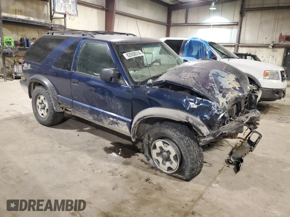 2001 Chevrolet Blazer LS z VIN 1GNCT18W01K143093, wystawiony jako Copart lot #82650514 z przebiegiem Nie podano mil oraz Szkoda całkowita • Salvage title. Historia ofert i sprzedaży dostępna na DreamBid. Obrazek 4.