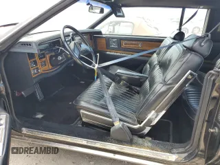 1985 Cadillac Eldorado z VIN 1G6EL578XFE614641, wystawiony jako Copart lot #75663984 z przebiegiem 54 128 mil mil oraz Szkody całkowita. Historia ofert i sprzedaży dostępna na DreamBid. Obrazek 7.