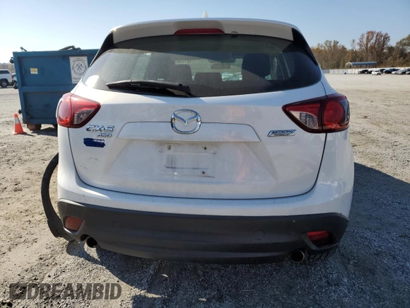 2013 Mazda CX-5 Sport z VIN JM3KE4BEXD0158031, wystawiony jako Copart lot #77827644 z przebiegiem Nie podano mil oraz Szkoda całkowita • Salvage title. Historia ofert i sprzedaży dostępna na DreamBid. Obrazek 6.