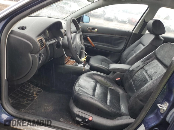 2002 Volkswagen Passat GLX z VIN WVWTH63B32P069555, wystawiony jako Copart lot #85990984 z przebiegiem 69 310 mil mil oraz Czysty tytuł • Clean title. Historia ofert i sprzedaży dostępna na DreamBid. Obrazek 7.
